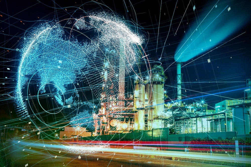Power plant or factory with blue, digitally networked globe Power plant or factory with blue, digitally networked globe