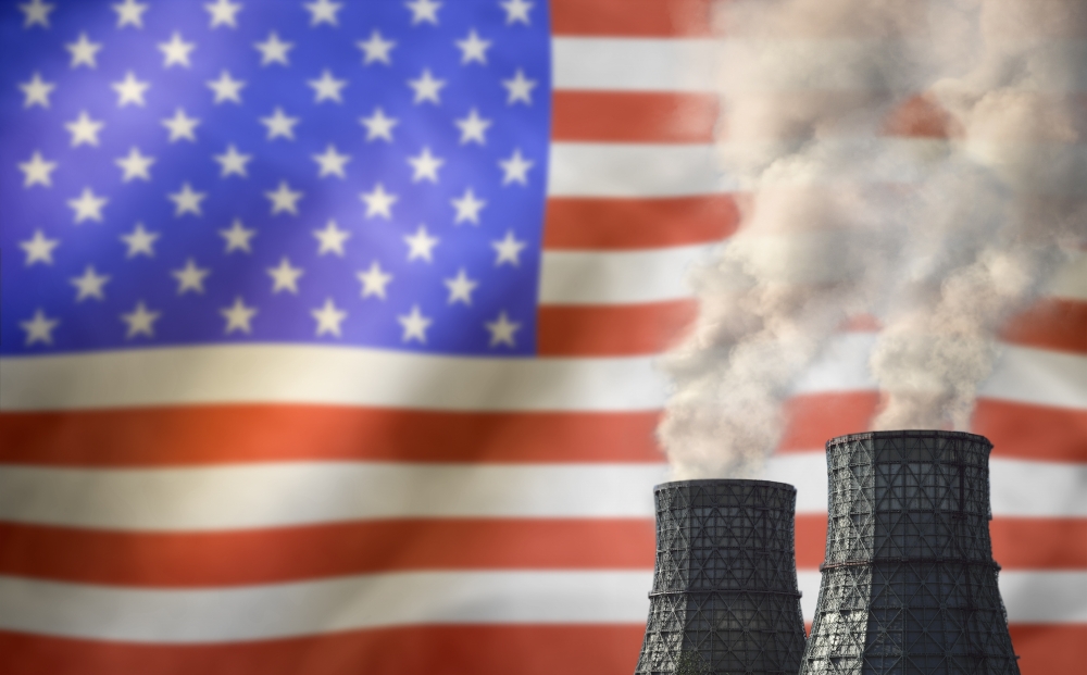 thermal smokestacks against U.S. flag