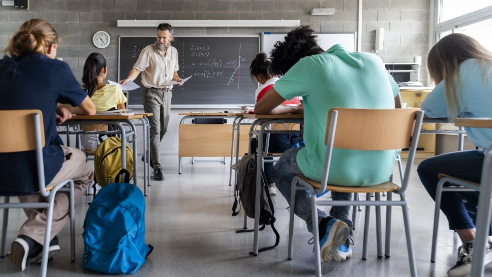 High school math class with male teacher High school math class with male teacher