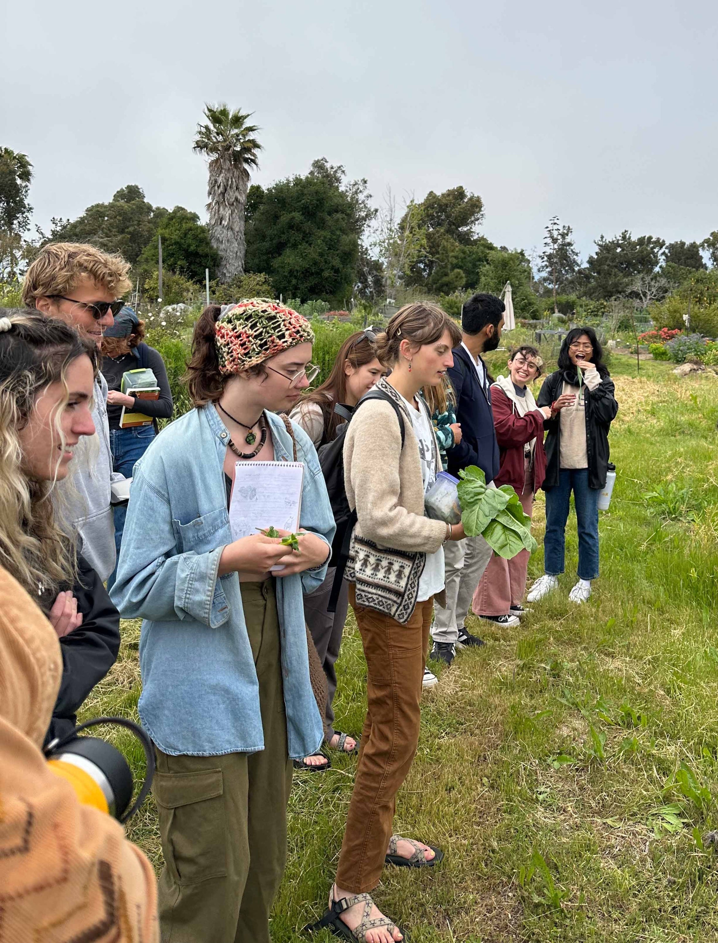 Students at garden with notebooks