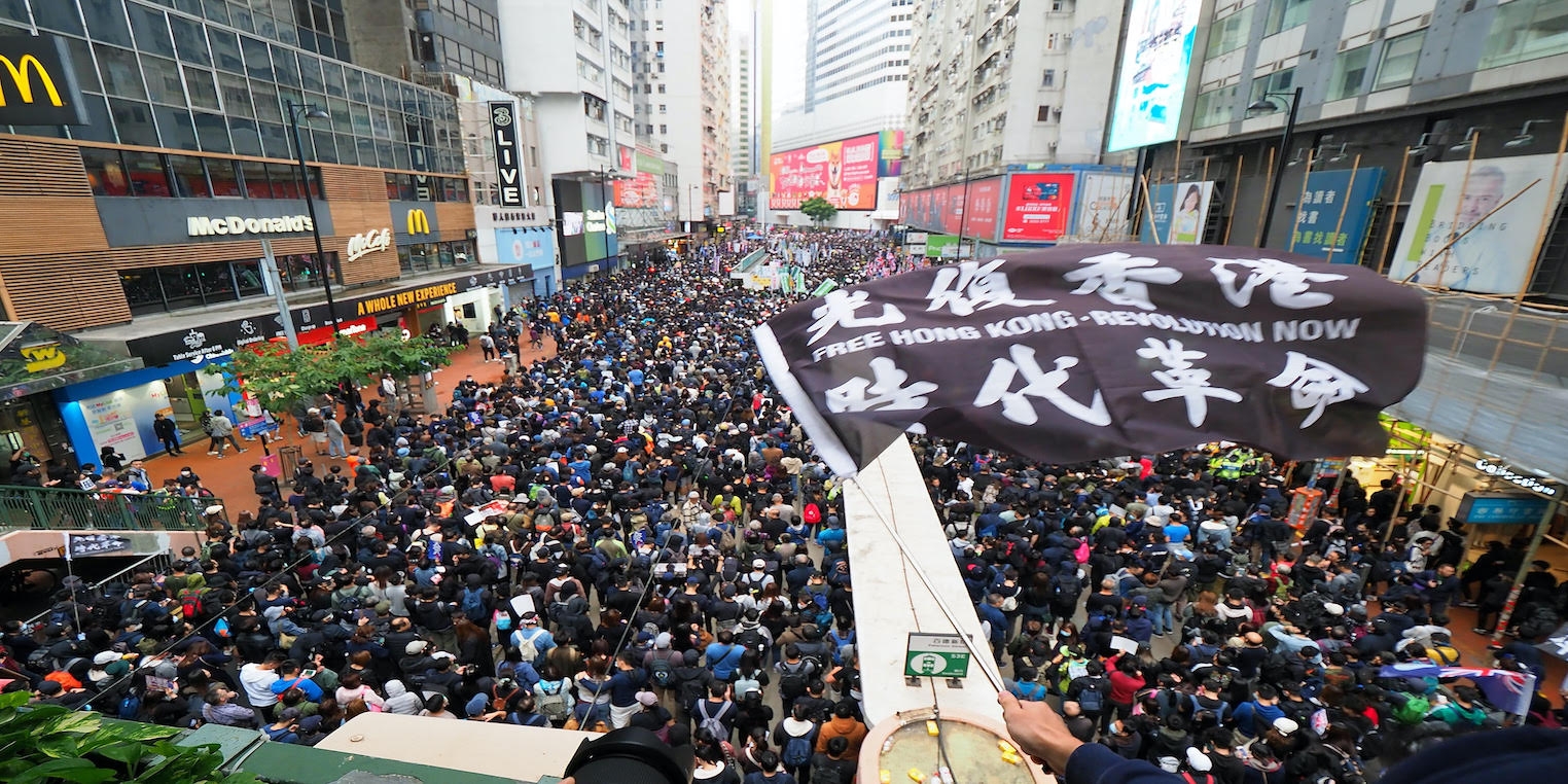 photo of a crowd protesting in Hong Kong