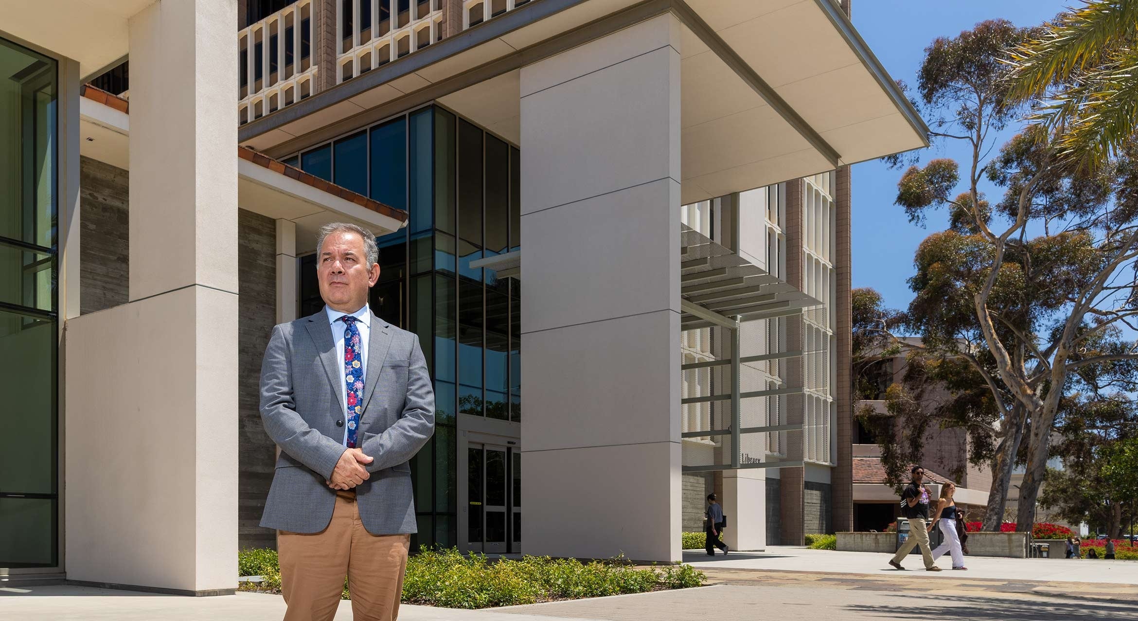 color photograph of Todd Grappone standing in front of the library